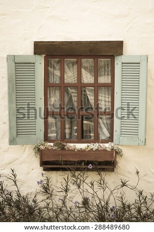 vintage window on white wall - soft focus with vintage filter