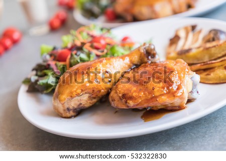 grilles chicken steak with teriyaki sauce on dinning table
