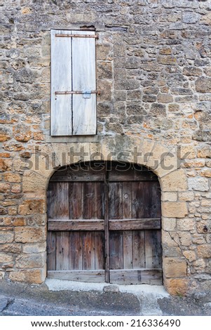 Closeup view of rural door and window in the french region of Dordogne