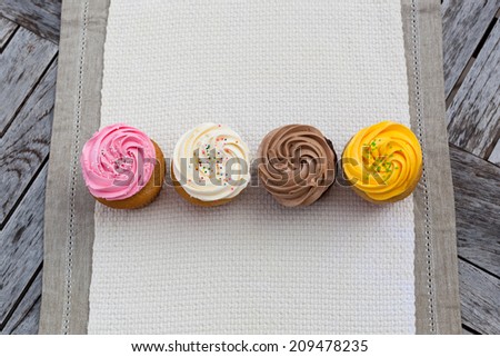 Delicious Cupcakes on table linens