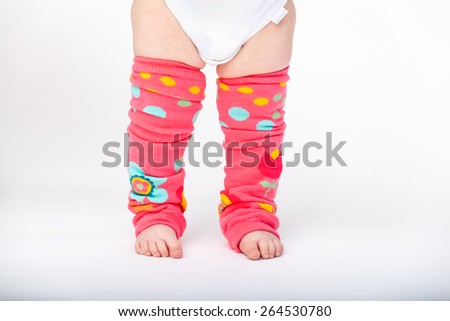 Adorable baby girl wearing baby leg warmers