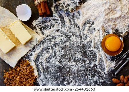 Top view of cookies ingredients, dough recipe - flour, sugar, egg, butter on rustic wooden background.