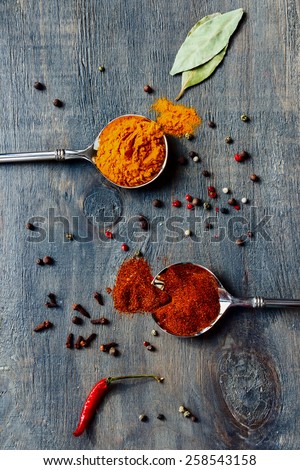 Top view of Bright spices over wooden background. Cooking or spicy food concept.