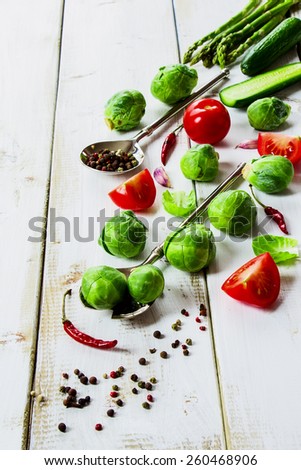 Healthy Organic Vegetables and spices on White Wooden Background. Healthy food, diet or cooking concept.