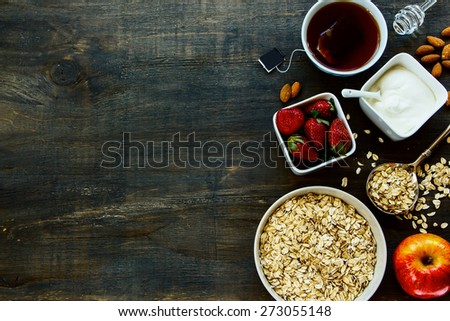 Healthy Breakfast. Oats, berries and tea. Health and diet concept. Top view.