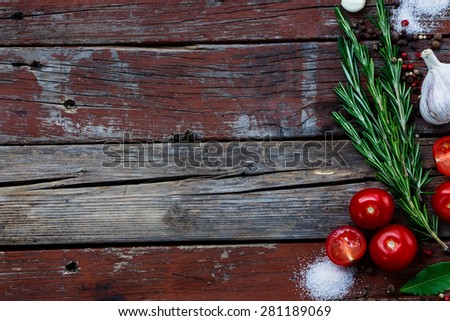 Background with bunch of herbs and spices on rustic wooden texture. Cooking, vegetarian food or health concept. Space for text.