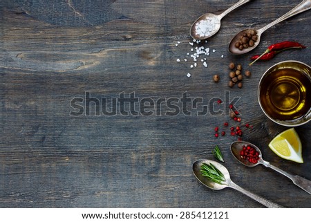 Various Spices. Herbs and spices selection - old metal spoons and rustic wooden background. Cooking, food or health concept.