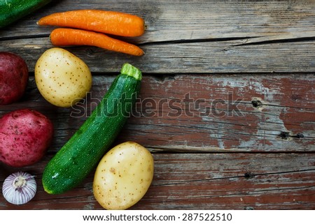 Fresh organic ingredients for cooking on rustic wooden background. Vegetarian food, health  concept.