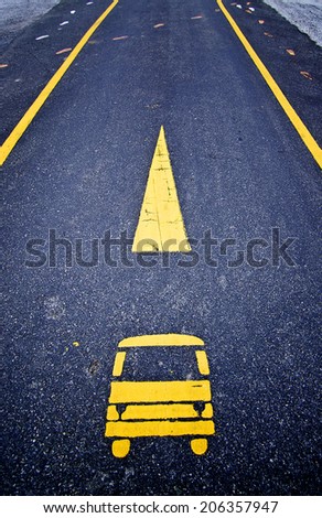 Bus lane sign on the asphalt