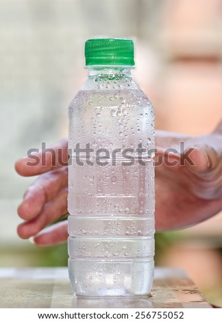 Cool purify drinking water in a clear bottle,bottle focus.