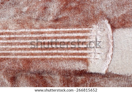 The imprint of guitar string on velvet,inside of guitar case.