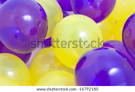 Many yellow and purple balloons background