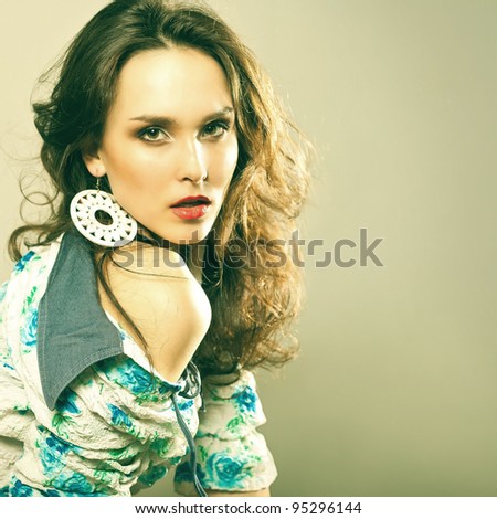 Young beautiful fashion model with hair and make-up professionally done