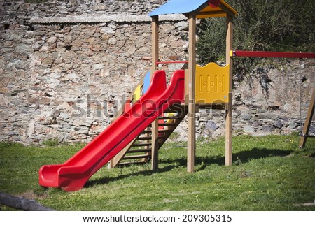 Childrens slide/Childrens slide in public park.