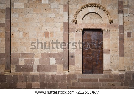 Side door/Old Romanesque church side door.