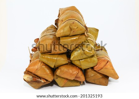 Thai traditional sticky rice dessert in banana leaf packaging