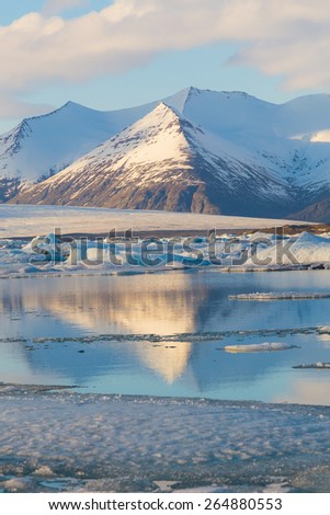 Snow mountain reflection in Jokulsarlon lagoon