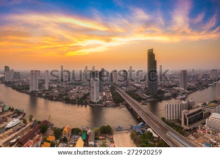 Modern Business Building along the river curve  in Bangkok city during sunset(Thailand)