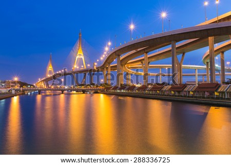 Suspension Bridge across the river at twilight The Industrail Ring Road Bangkok Thailand Suspension Bridge across the river at twilight The Industrail Ring Road Bangkok Thailand