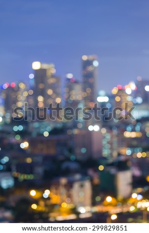 Abstract blurred bokeh light at night of city downtown skyline