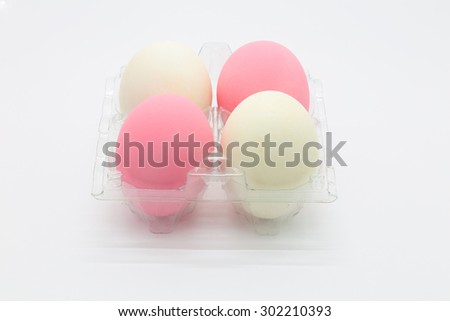 Preserved organic pink eggs and salted eggs white background
