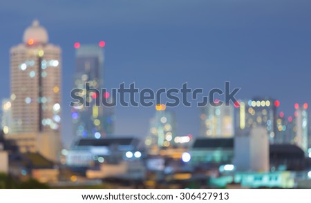 Abstract blurred bokeh light, city skyline with blue sky during twilight