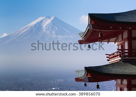 Mt. Fuji viewed from behind red Chureito Pagoda, Japan during late winter