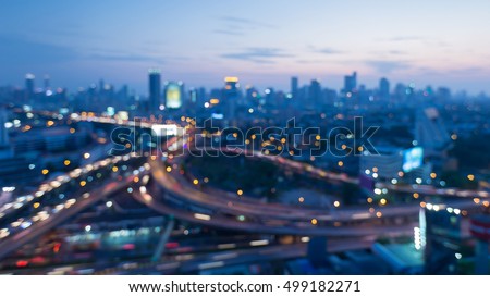 Abstract blurred lights highway interchanged with city downtown background