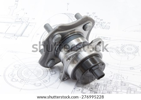 hub with bearing and ABS sensor on the background of drawings and plans