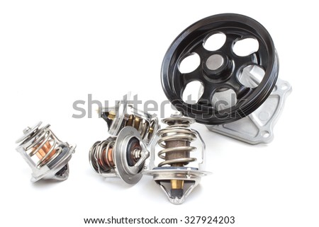 Parts of the car engine. Four of the thermostat and water pump engine cooling system on a white background