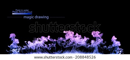 Violet clouds of paint in water. Abstract figure of paint. Watercolor spinning in water on black background.