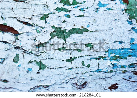 Peeling paint on wall. Cracked paint on  a wooden wall.