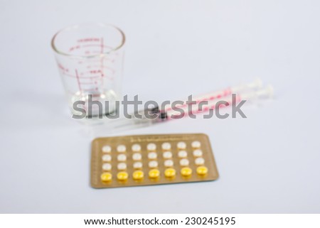 blurred , Birth control pills on white background,vintage color tone .