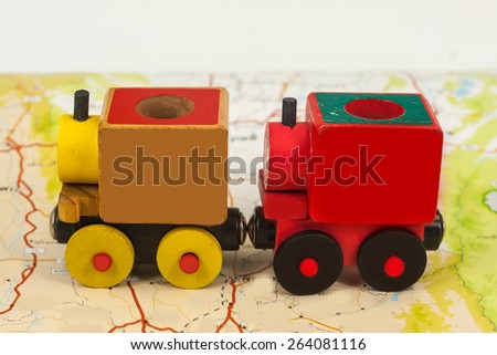 wooden toy train on map , abstract background for solution of transportation or traveling concept.