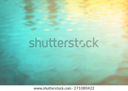blurred water with sunlight and shadow, vintage color tone for abstract texture background.