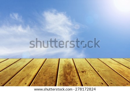 empty perspective wooden plank floor with clear sky background, template mock up for display of your product.