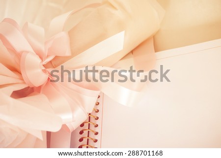 soft focus of wedding bouquet with notebook ,vintage color tone.