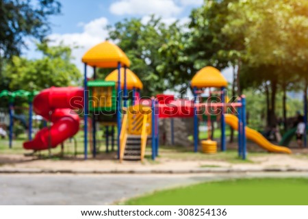 blurred of playground on day noon light in city park.