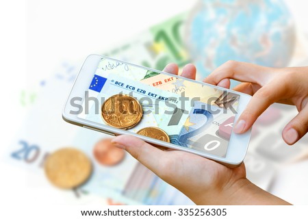 woman hand hold and touch screen smart phone,tablet,cellphone on euro bank note ,coins, and globe, abstract background for mobile banking,online banking concept.