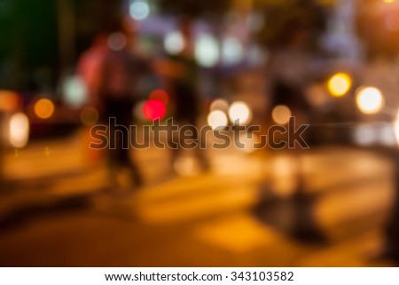 blur people walk in street city night light background.