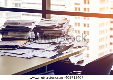 busy office with stack document on table.