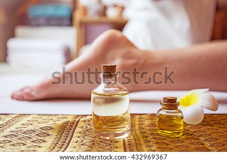 Thai foot massage alternative medicine therapy with Thai herb aroma oil ,background for spa or alternative medical therapy concept.