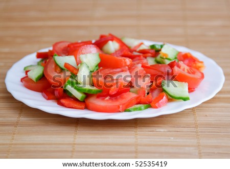 Side dish with green cucumber and red tomato