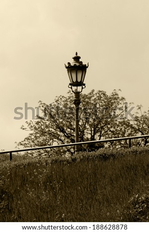 Old street lamp in old fashion sepia style.