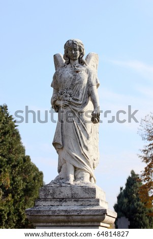 this is a old angel sculpture, on the cemetery.