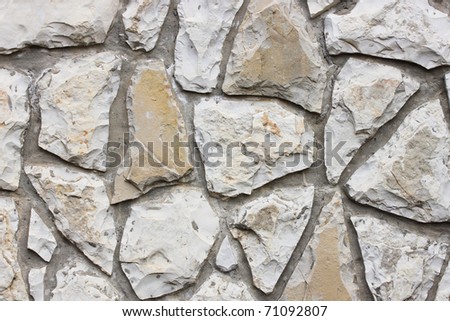 This is wall made from stones, like some stone background.
