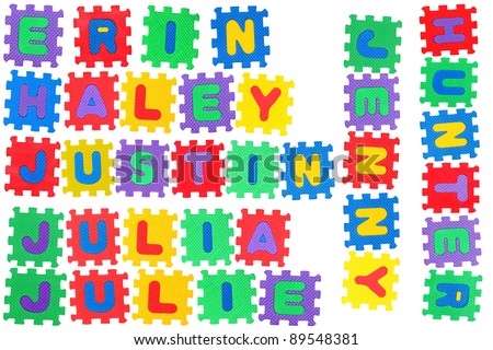 The names ERIN, HALEY, JUSTIN, JULIA, JULIE, JENNY, and HUNTER made of letter puzzle, isolated on white background.