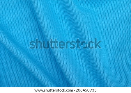 Textured background of blue cotton fabric