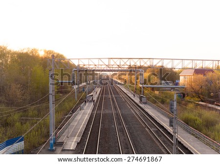 Tyumen, Russia - May 03, 2015: People waiting for the arrival of the train. Top view from the bridge on Trans-Siberian Railway.