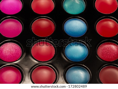 Close-up shot of lip gloss palette, soft focus
